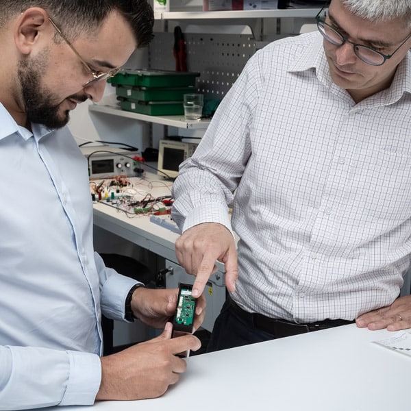 Engineers working on a custom thermal printer